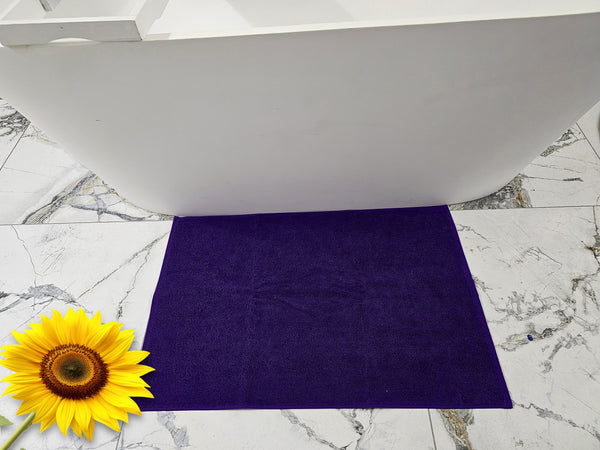 Plush bath mat in purple
